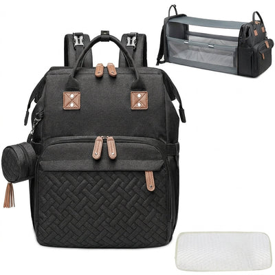 Schwarzer Wickelrucksack mit integriertem Reisebett, Moskitonetz und Wickelunterlage für unterwegs