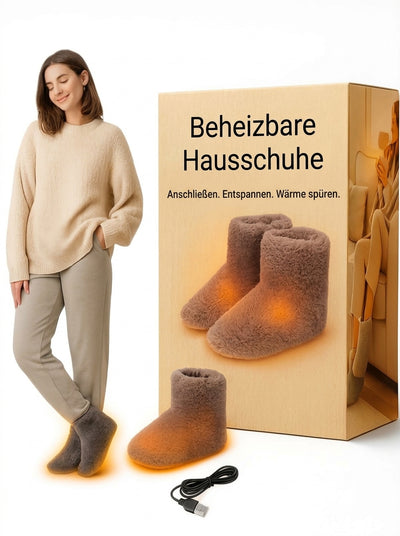 Elektrisch beheizte Hausschuhe mit USB-Anschluss für warme Füße, präsentiert von einer Frau in gemütlicher Kleidung.