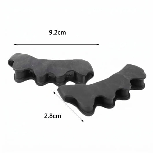 Zwei schwarze Hammerzehenkorrektoren aus Silikongel mit Maßangaben von 9,2 cm und 2,8 cm.