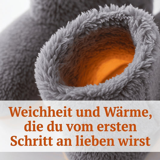 Nahaufnahme eines grauen, flauschigen Hausschuhs mit orangefarbenem Innenfutter, der Wärme und Komfort verspricht.