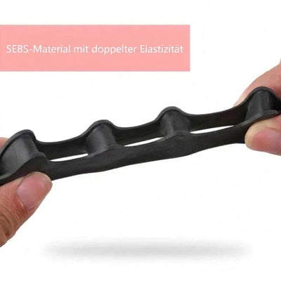 Ein Hammerzehenkorrektor aus elastischem SEBS-Material wird von zwei Fingern gedehnt.